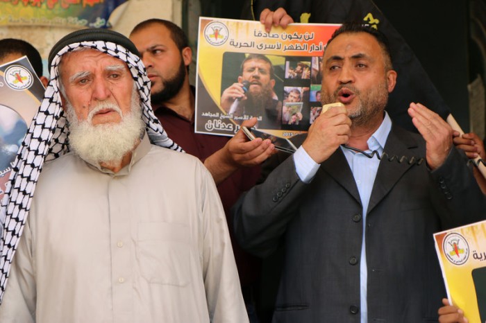 Adnan Mousa, left, attends a 23 May rally in Arrabeh village in the occupied West Bank, in solidarity with his son Khader Adnan who is on a total hunger strike against his administrative detention by Israel. (Ahmad Al-Bazz \ ActiveStills)
